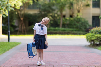 Back to school. little girl from elementary school outdoor. kid going learn new things 1th september