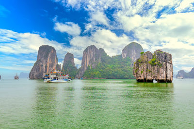 Panoramic view of boats in sea against sky