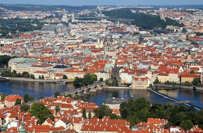 High angle view of river and cityscape against sky