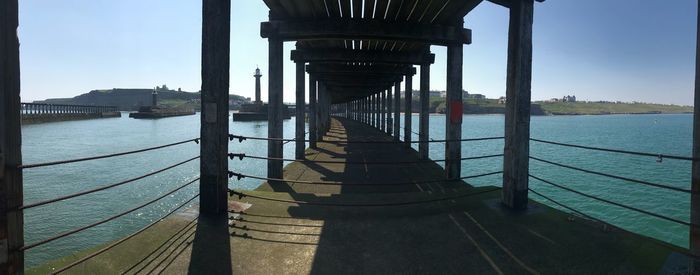Pier over sea against sky
