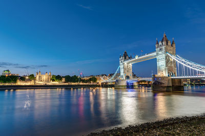 The tower bridge and the tower of london at night