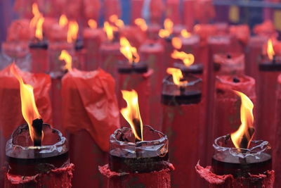 Lit candles in temple