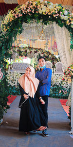 Young couple kissing on flower