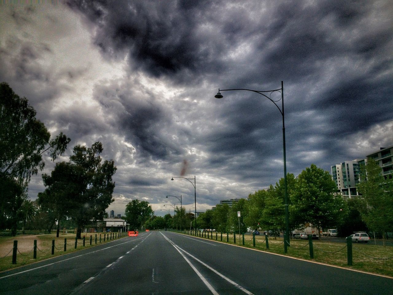 sky, the way forward, cloud - sky, cloudy, road, transportation, diminishing perspective, vanishing point, overcast, tree, road marking, cloud, storm cloud, weather, street, empty road, empty, country road, nature, street light