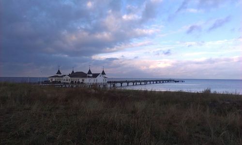 Scenic view of sea against cloudy sky