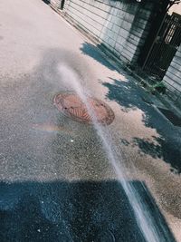 High angle view of wet street in city