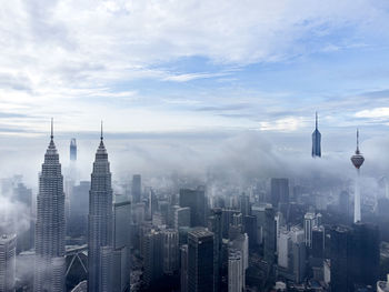 Aerial view of cityscape against sky