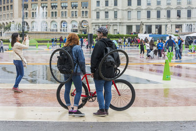 People on bicycle in city