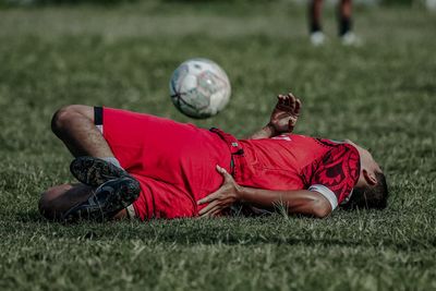 Man playing soccer on field