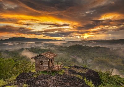 Scenic view of landscape against sky during sunset