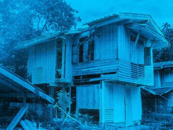 Low angle view of abandoned building against sky