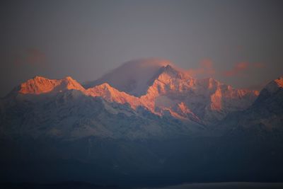 Rising sun rays glittering in the kangchenjunga - the himalayas