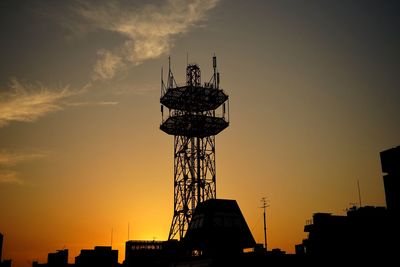 Silhouette of tower against sky during sunset