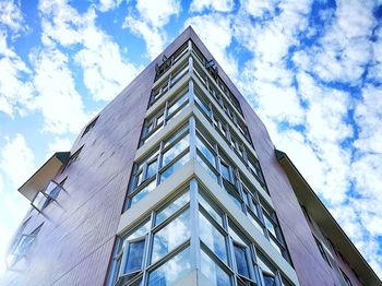 Low angle view of office building against sky