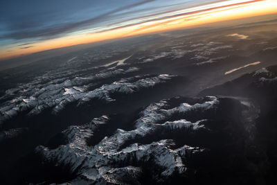 Aerial view of landscape against sky during sunset