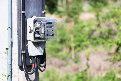 Close up of electric meter on electric pole, electrical equipment