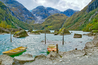 Scenic view of lake and mountains against sky