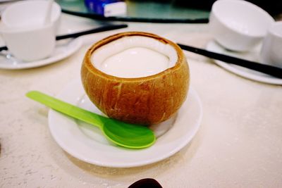 Close-up of coffee served on table