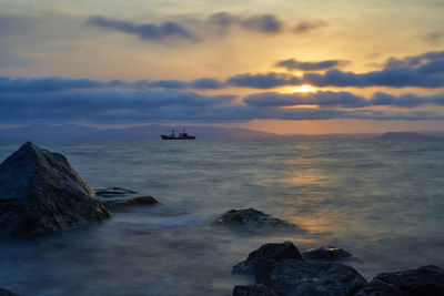 Scenic view of sea against sky during sunset