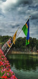 Multi colored flag against blue sky