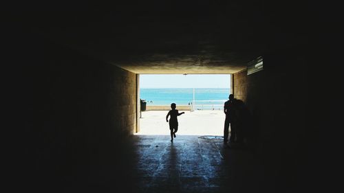 Silhouette of woman in sea