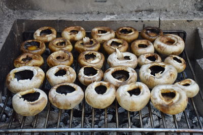 High angle view of mushrooms on bbq