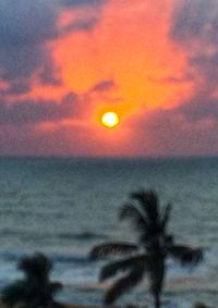 Scenic view of sea against romantic sky at sunset