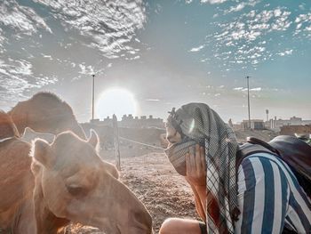 Panoramic shot of people at observation point against sky