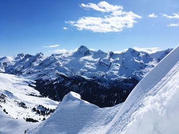 Scenic view of snowcapped mountains against sky