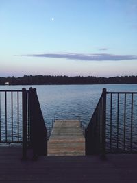 Pier over lake against sky