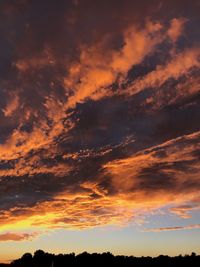 Low angle view of dramatic sky during sunset