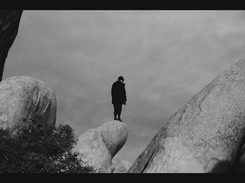 Full length of woman standing against sky