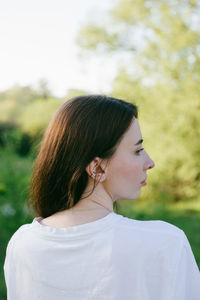 Side view of young woman looking away