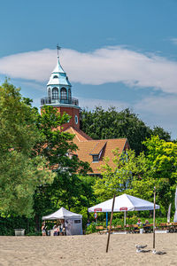 Gazebo by building against sky