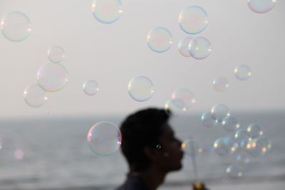 Close-up of bubbles against blurred background