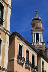Low angle view of bell tower against sky