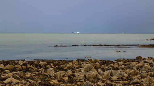 Scenic view of sea against clear sky