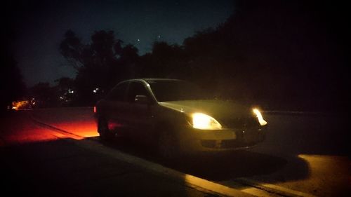 Car moving on road at night