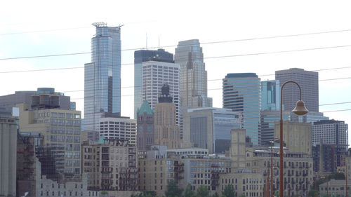 Low angle view of buildings against sky in city