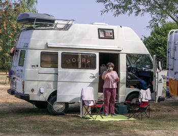 Man with woman standing by cart on street