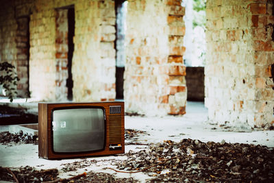 Old television set in abandoned house