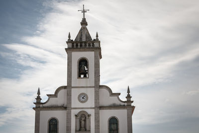 Low angle view of church and building against sky