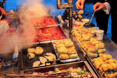 People having food at market stall