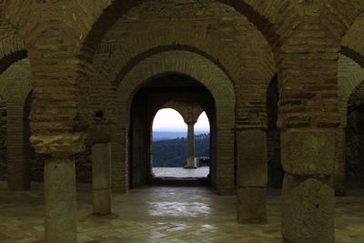 View of historic building seen through arch