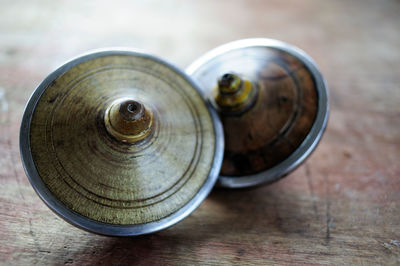 Close-up of spinning tops on wooden table