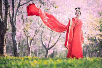 Portrait of woman with red flowers