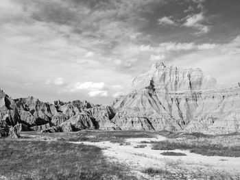 Scenic view of rock formation against cloudy sky