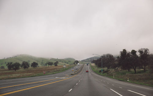 Road amidst landscape against sky