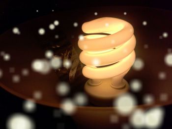 Close-up of illuminated light bulb