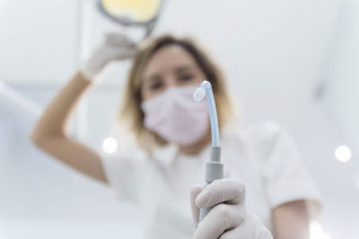 Portrait of doctor holding medical equipment